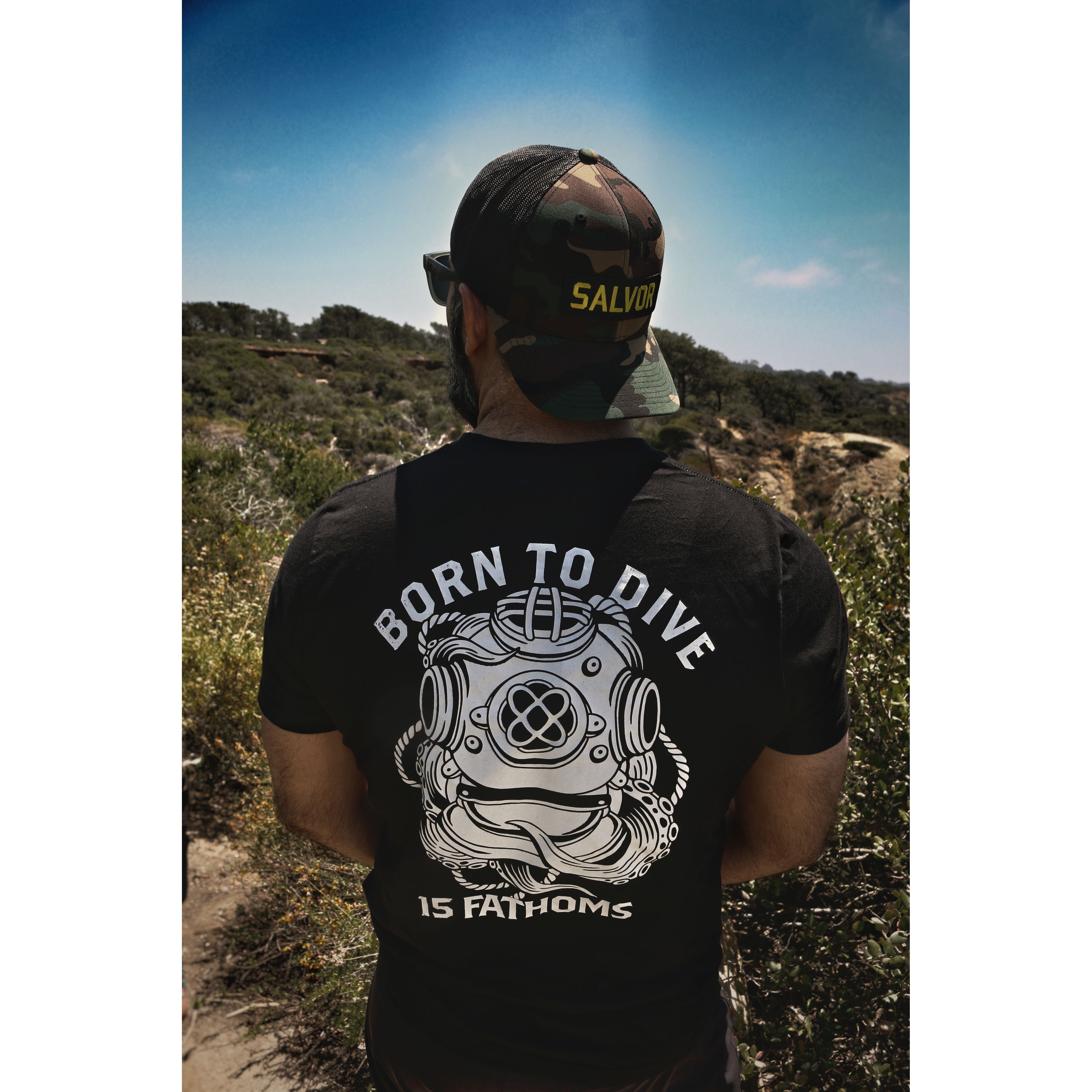 Man wearing backwards Salvor Hat while standing and looking outside