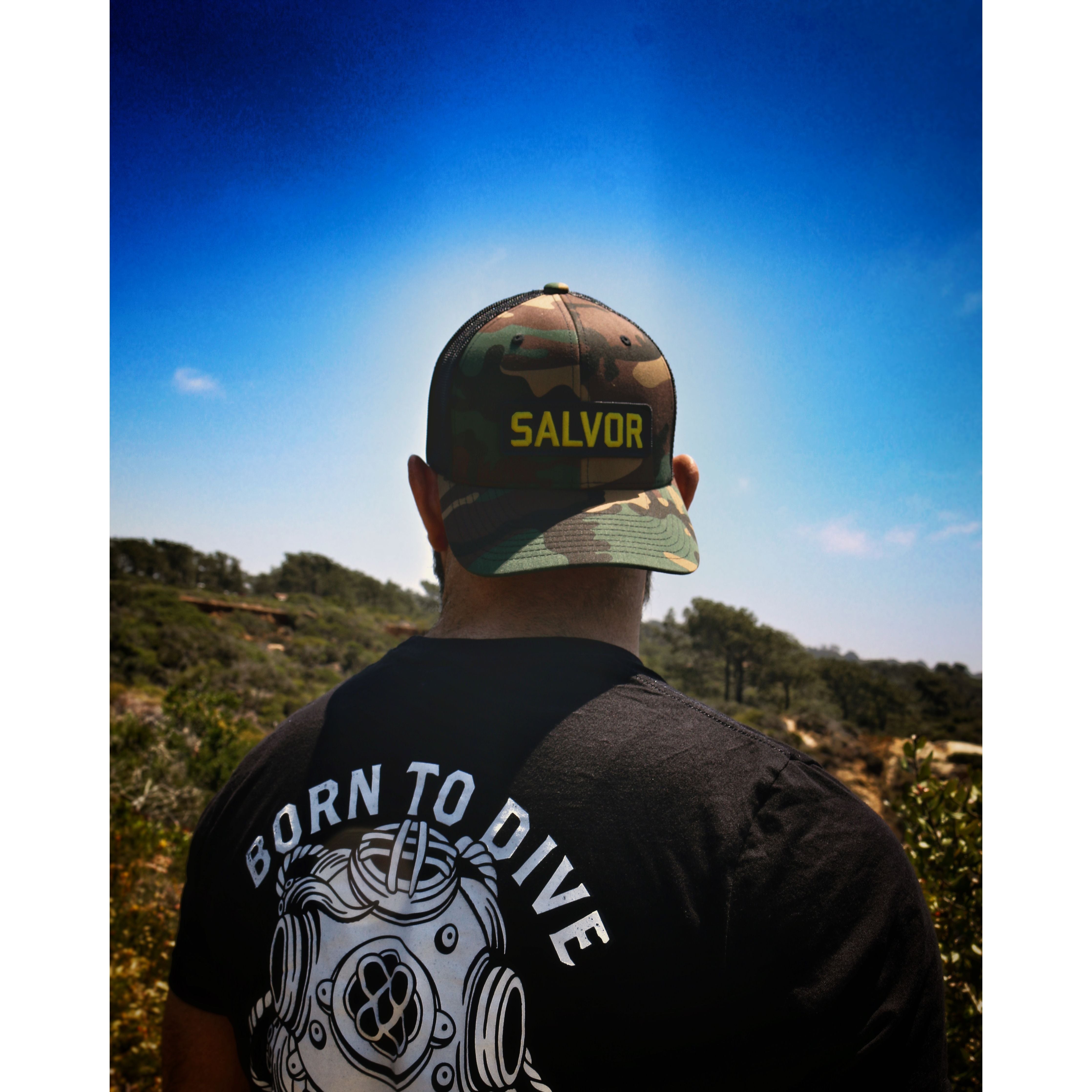 Man wearing backwards Salvor Hat while looking outside