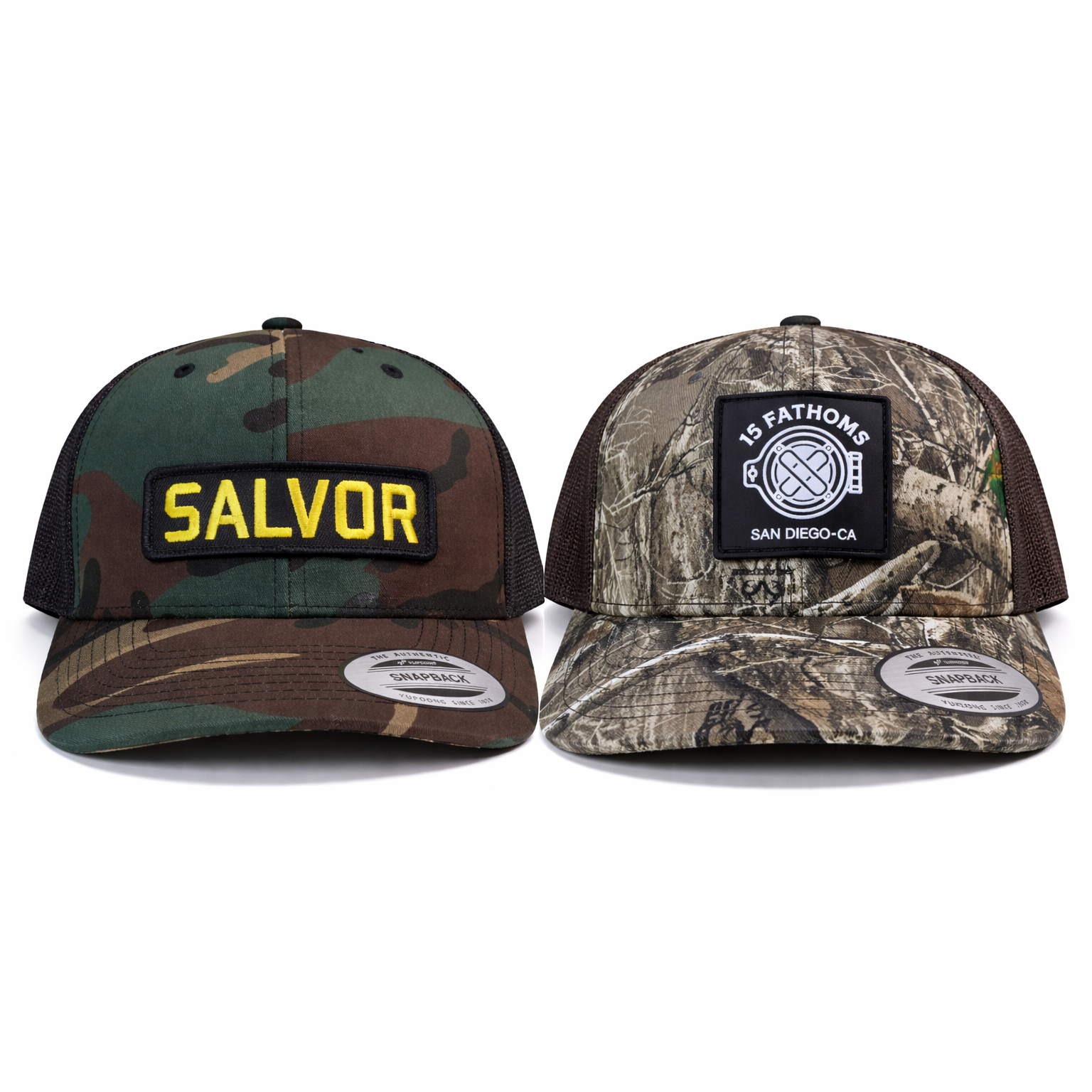 Two camouflage snapbacks with patches that read 'Salvor' and a 15 Fathoms helmet logo on a white background