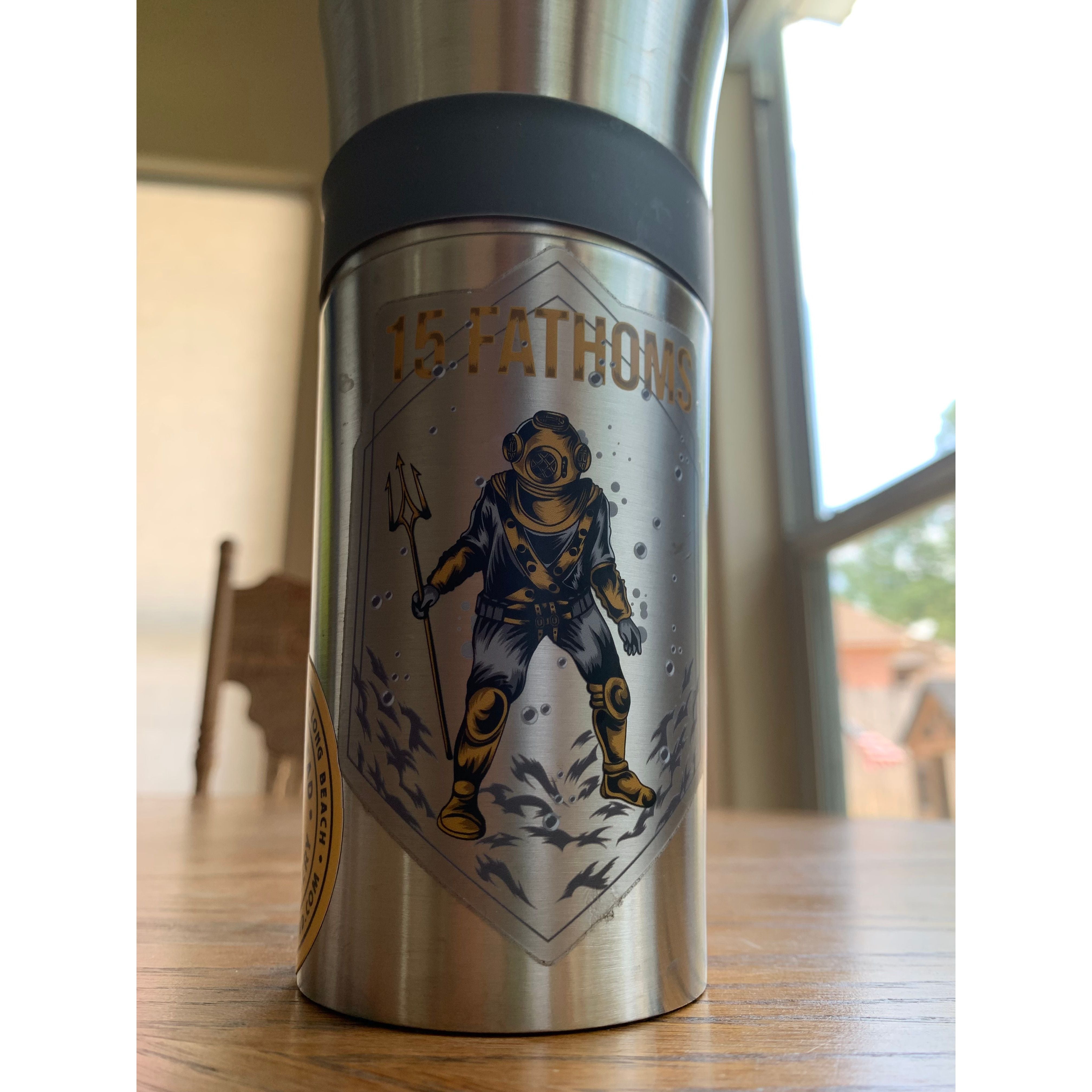 Trident diver buddy pairs - sticker of diver holding a trident with “15 Fathoms” text above placed on a canteen