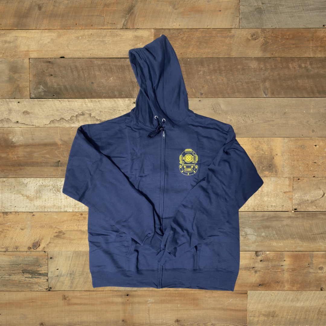 Iconic Hoodie - navy zip hoodie with gold diver helmet logo on the heart front on wooden background