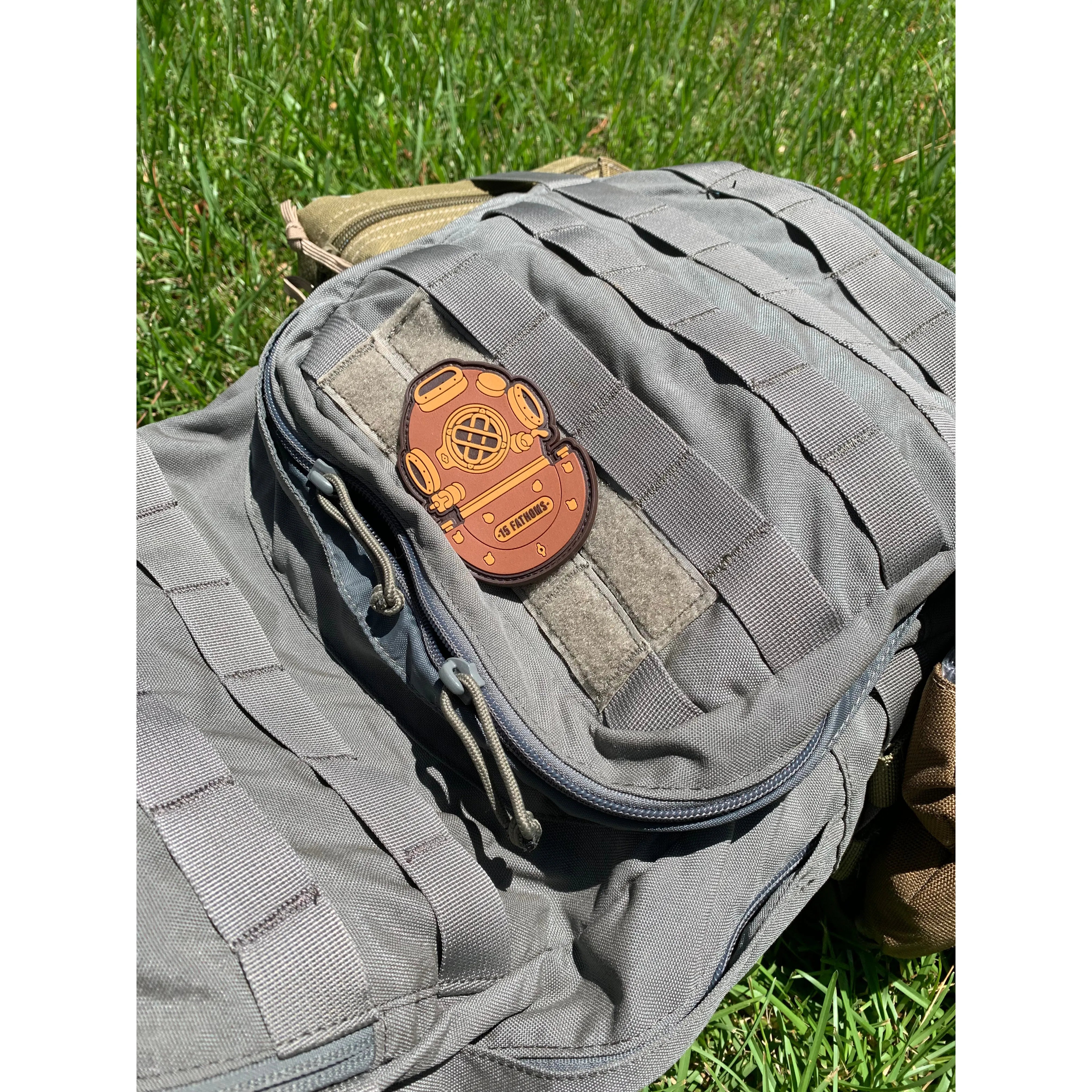 Mark-5 Patch - dive helmet with “15 Fathoms” text on base of helmet, placed on velcro backpack