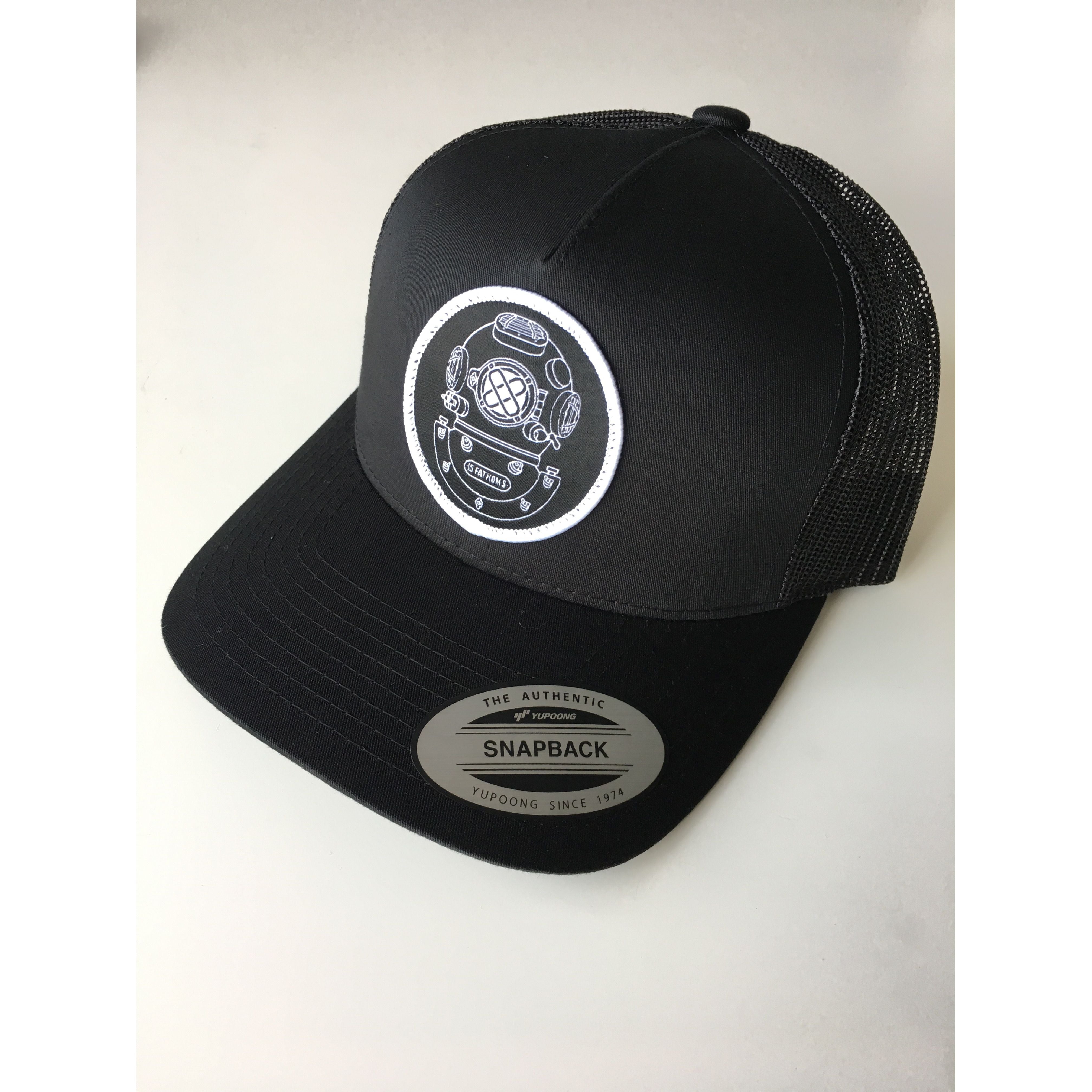 Mark-5 Hat - black snapback hat with diver helmet logo patch on front, front angle view