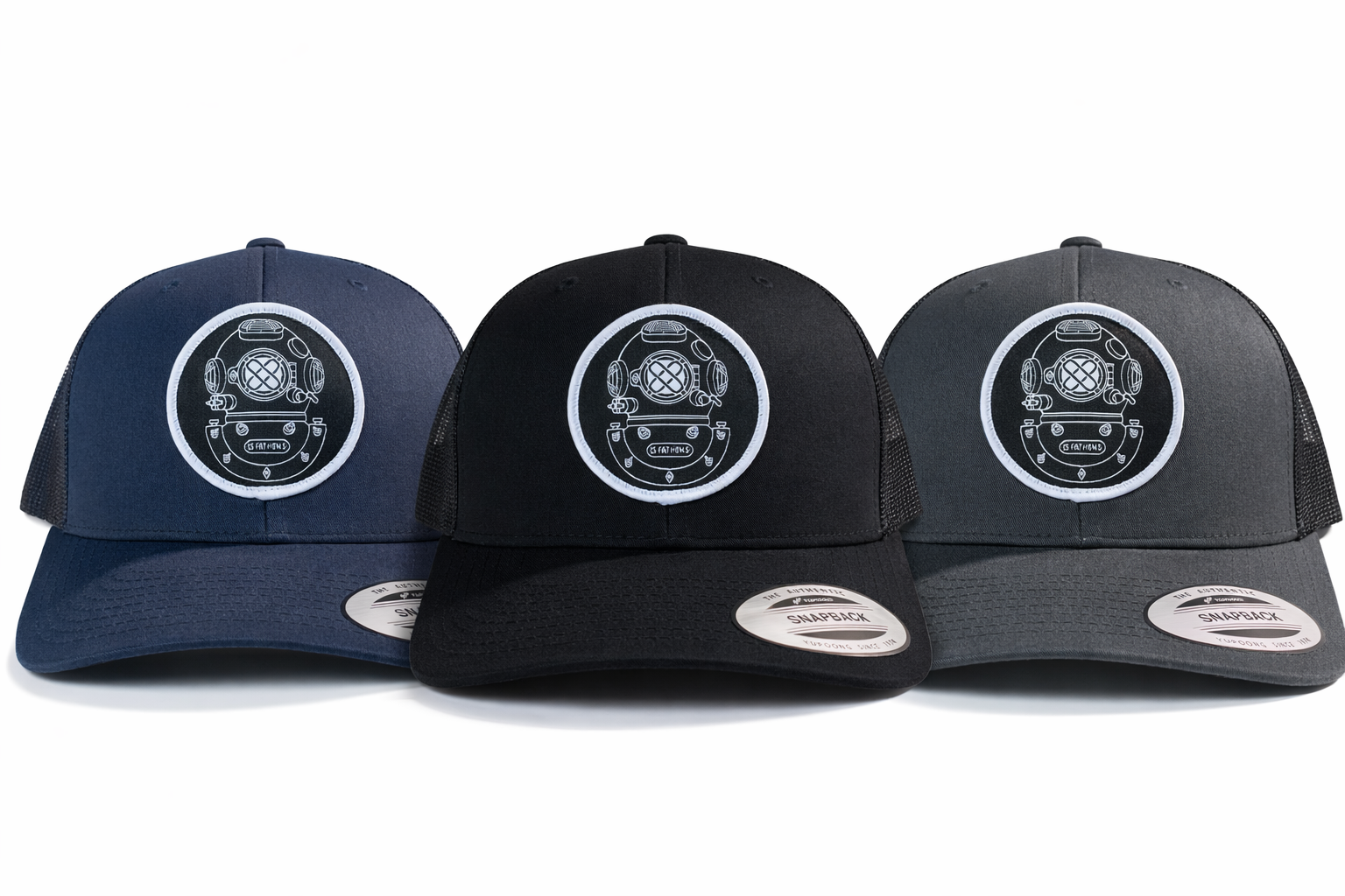 Three snapbacks in navy, black, and gray with 15 Fathoms helmet logos on a white background