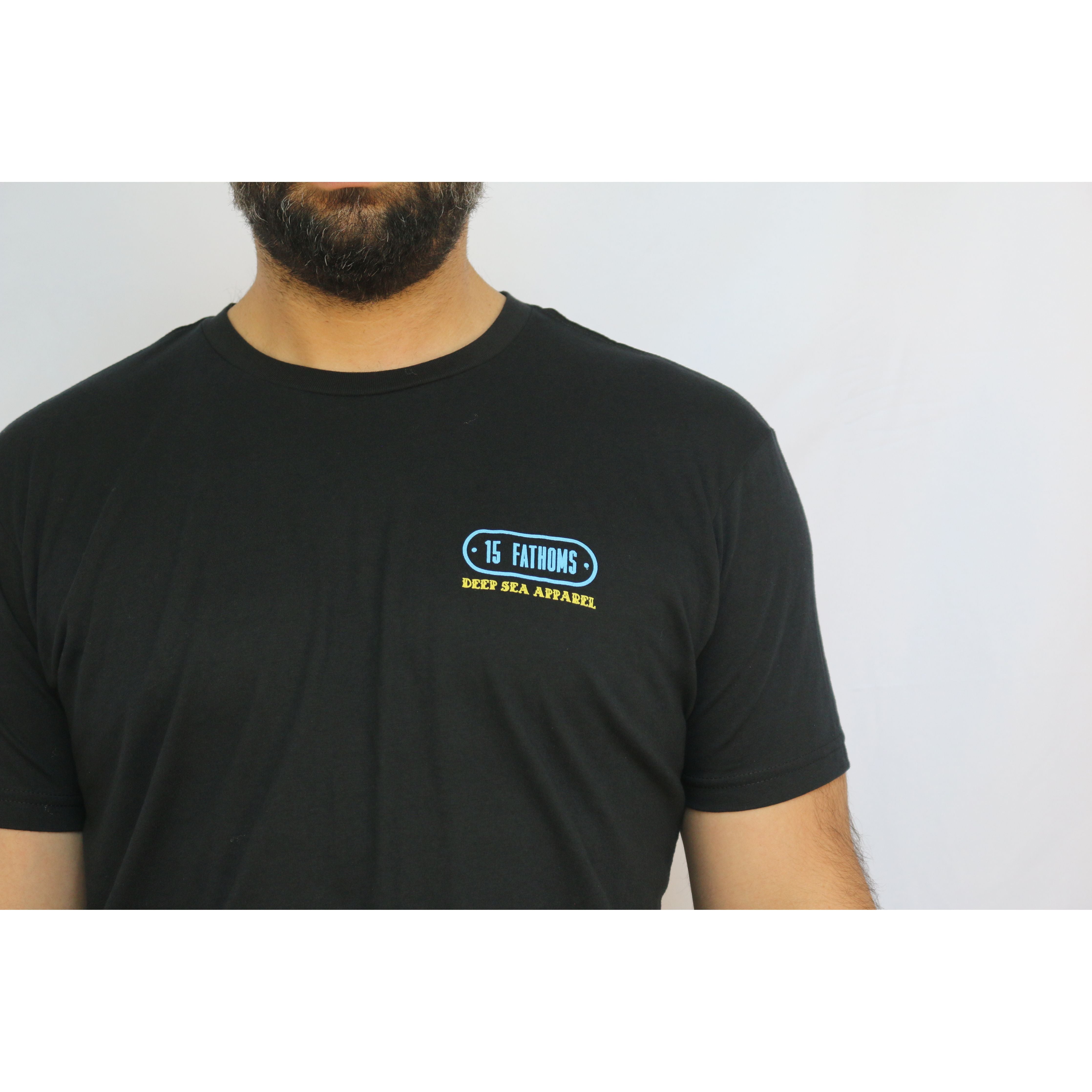 Kraken - close up of black t-shirt with "15 Fathoms Deep Sea Apparel" text over the heart on front