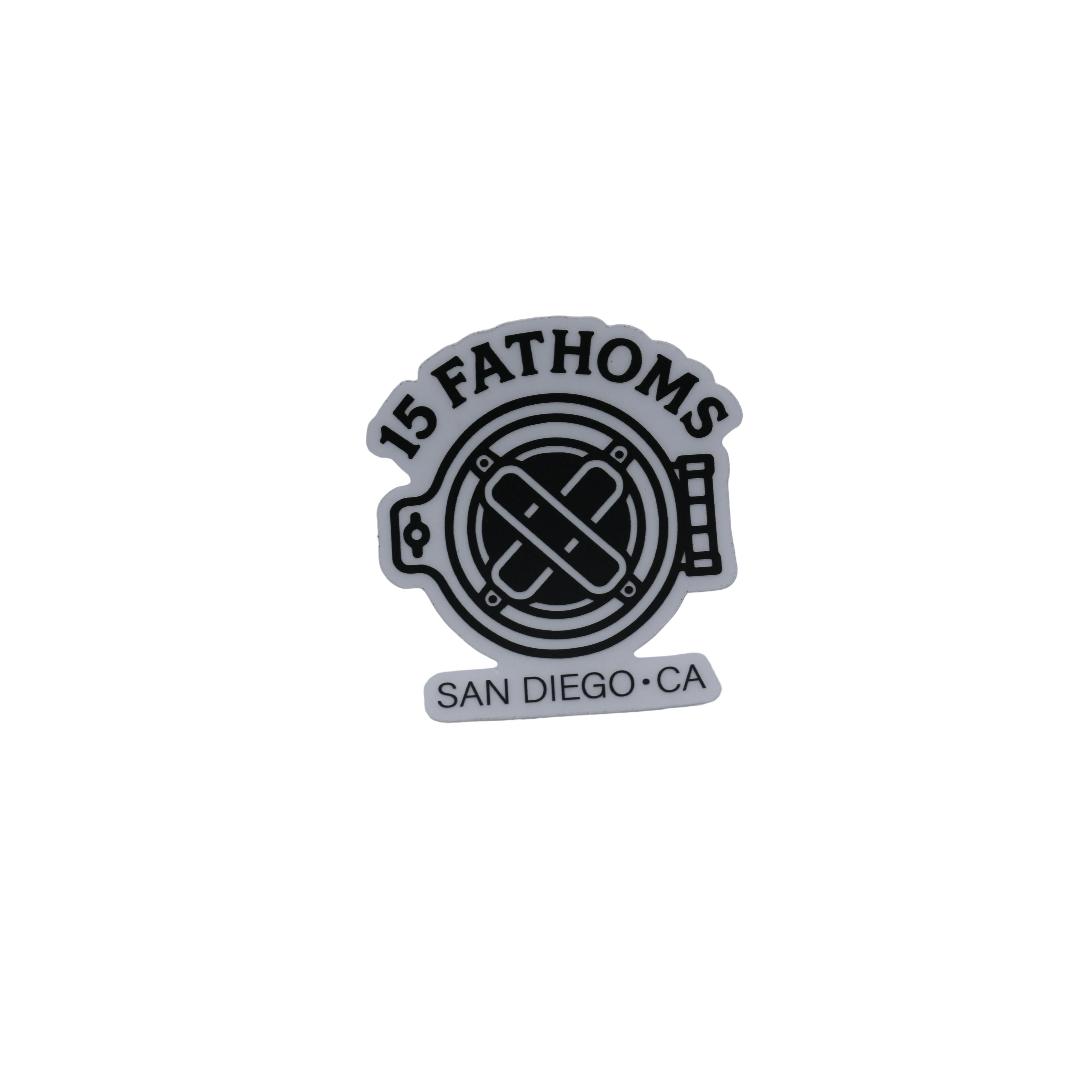 Black logo with '15 Fathoms' text on a textured gray background