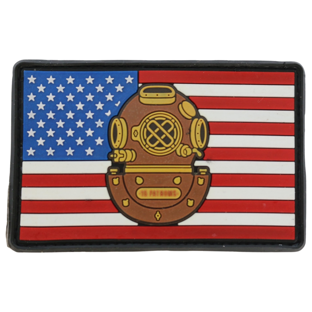 Show your love for your country and your favorite dive unit with our American Flag Mark-5 Patch. This patriotic patch is sure to stand out with its high-quality PVC construction and 8.5 X 5.5 cm size. A hook backing makes it easy to proudly display on any hat, jacket, or backpack. As American as apple pie and navy divers. 