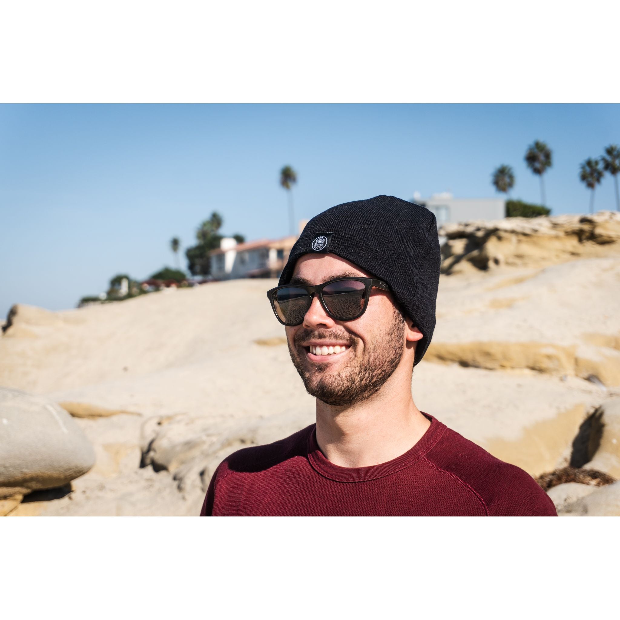 Sport Beanie - man wearing black beanie while smiling on a sunny day