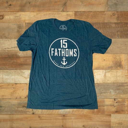 Our official logo and our very first design, this classic tee is soft, lightweight, and versatile.  This design is a piece of 15 Fathoms history.  Created in Hawaii in 2015, this design represents strength, loyalty, and an immense love for the ocean.  We’ve updated the design and are now using higher quality materials.  Don't miss out on owning a piece of 15 Fathoms history.  